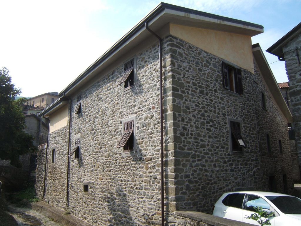 Detached stone House set in a village